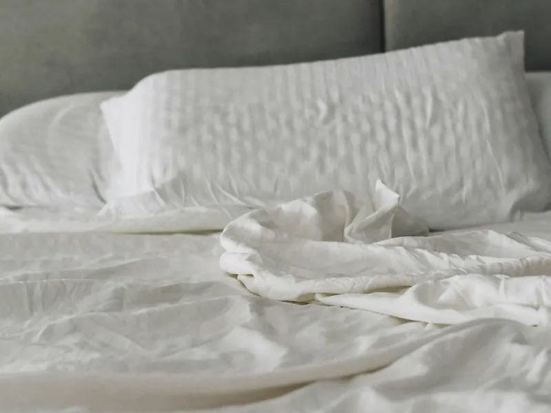 Clean white bed and pillows